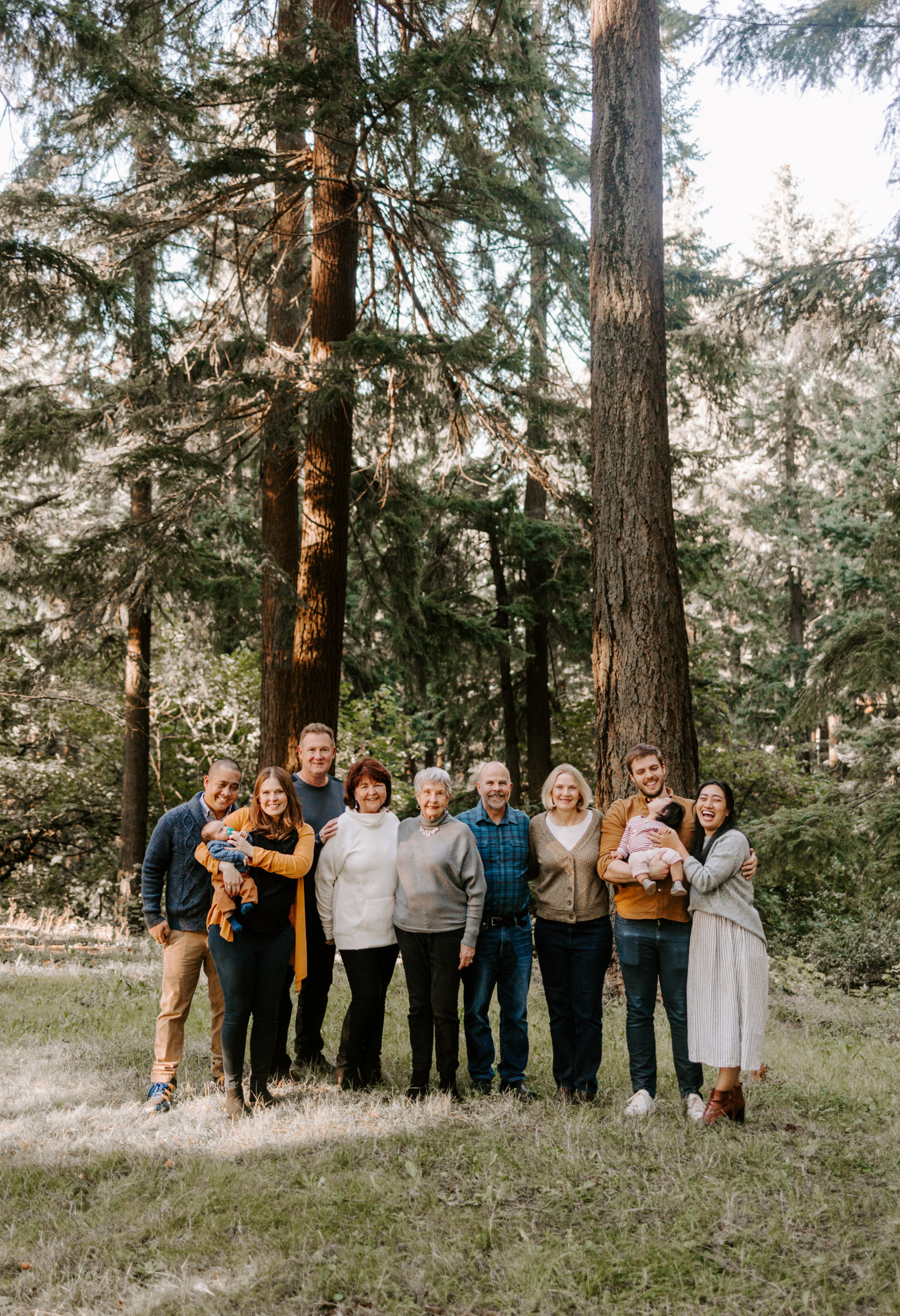 big group of extended family posed for generational family photo